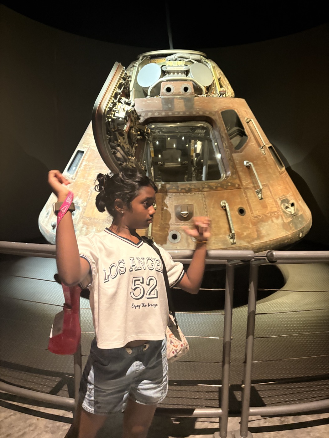 Tanya in front of an Apollo command module