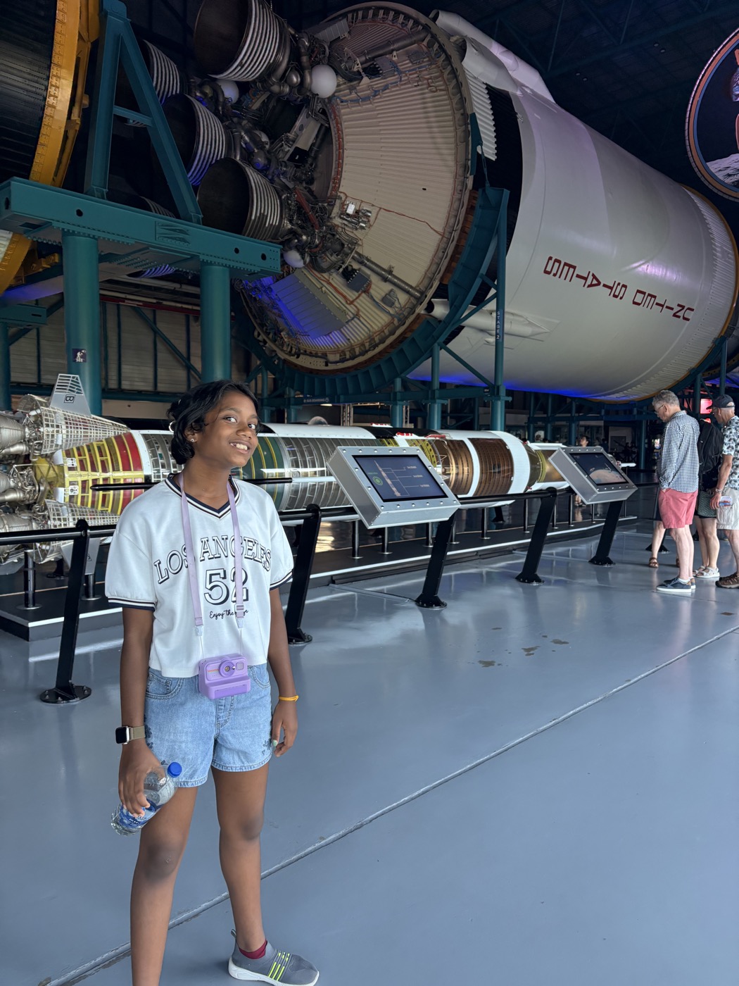 Tanya beside the real Saturn V engines